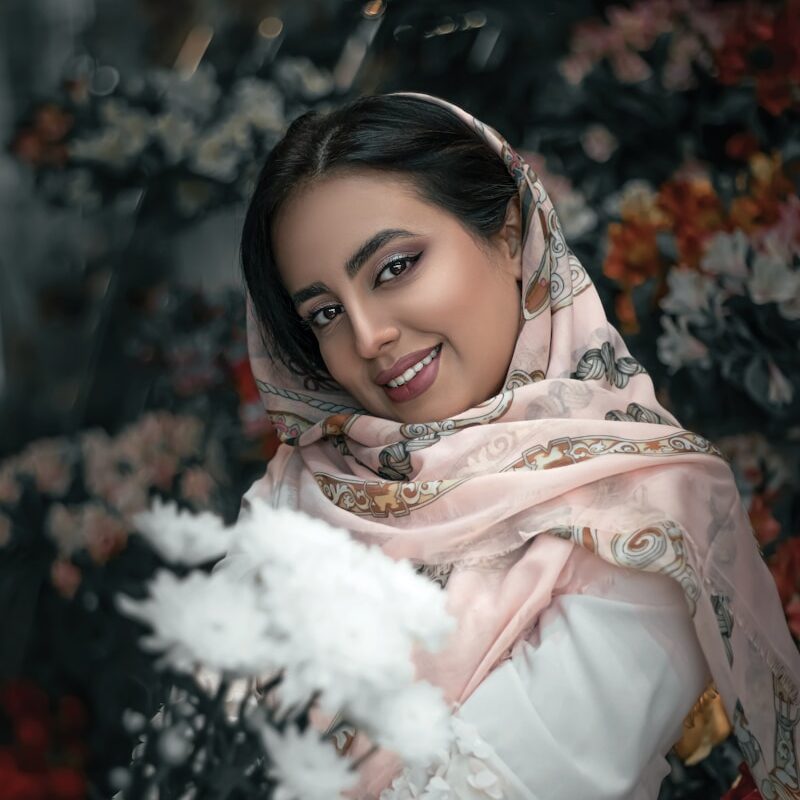 woman in white and brown floral hijab