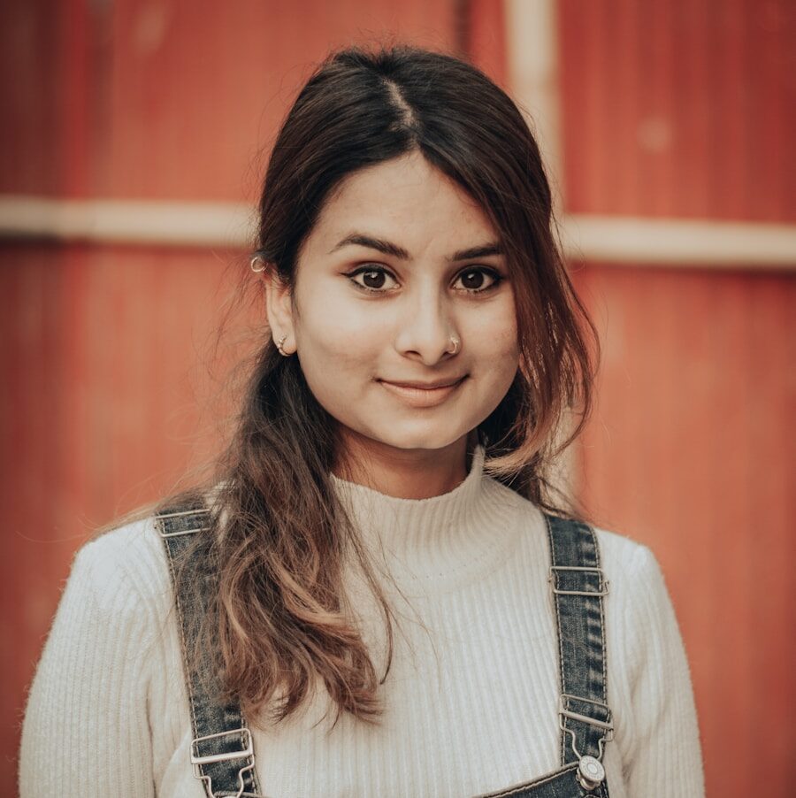 woman in white long sleeve shirt and blue denim dungaree